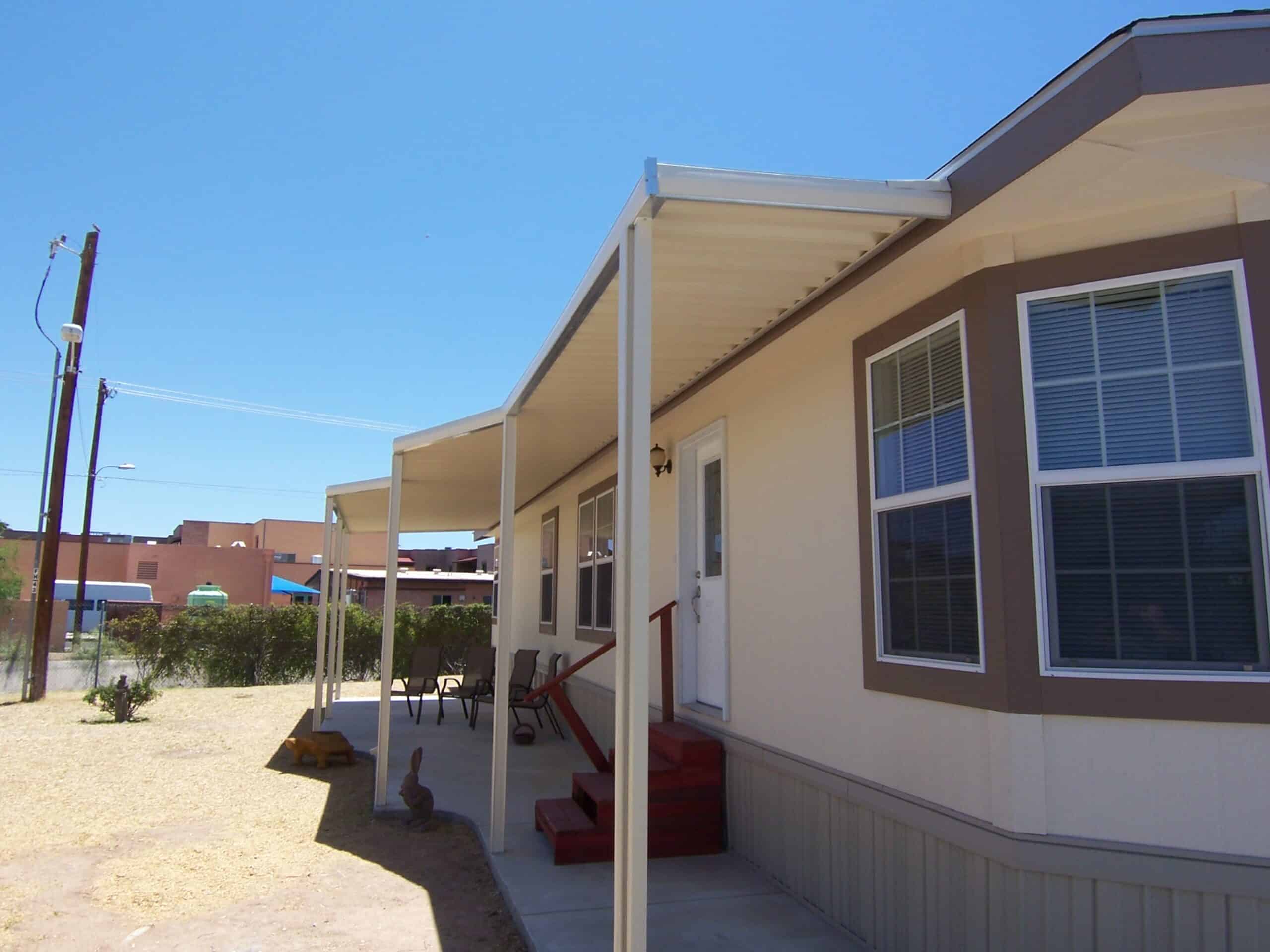 W-pan aluminum attached awning shading the side of a mobile home in Tucson, AZ
